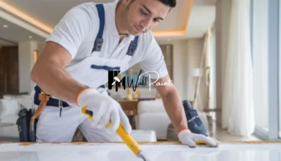 A-man-painting-a-wall-potentially-offering-wall-painting-services-in-Jumeirah