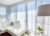 Bright-living-room-with-white-sheer-curtains-a-white-sectional-sofa-and-modern-decor